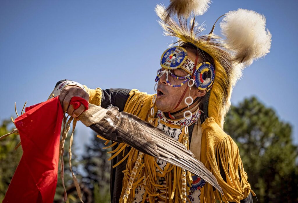 Native American Man in a Costume during a Celebration 